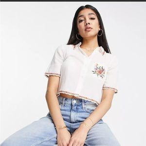 & Other Stories cotton cropped blouse with multi colored embroidery.